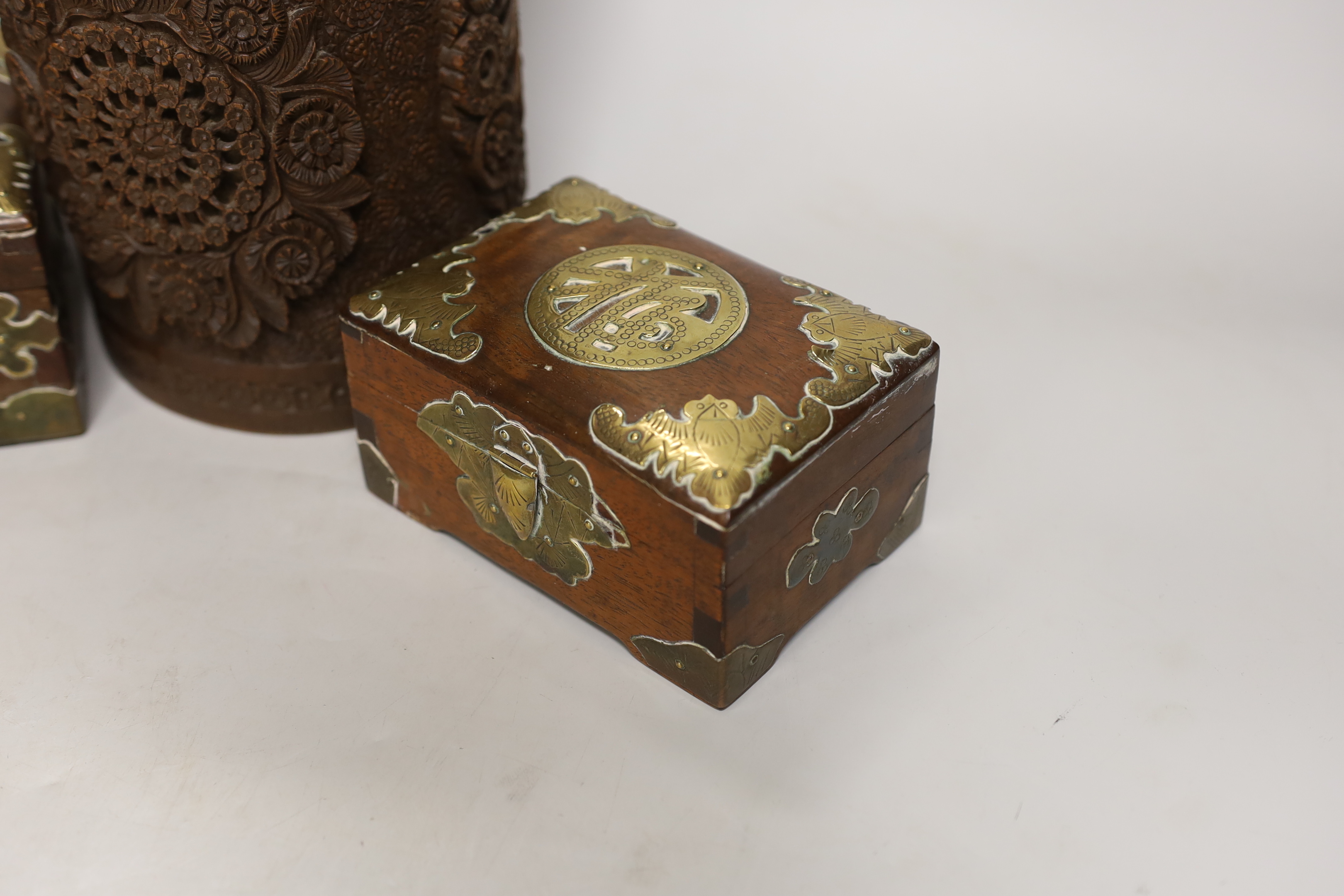 An Indian carved wood humidor and two Chinese brass mounted boxes, tallest 22cm high